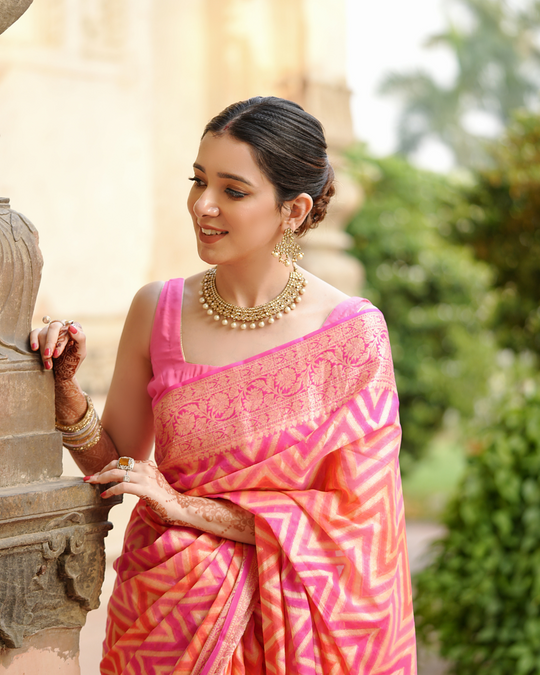 Sadabahaar Pure Chiffon Banarasi Silk Saree in Radiant Sunset Hues with Enchanting Chevron Weaves