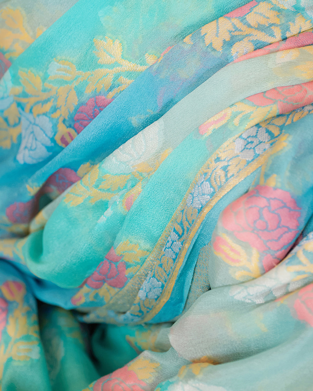 Aqua Blue Pure Chiffon Saree with Zari and Radiant Stripes Floral Detailing