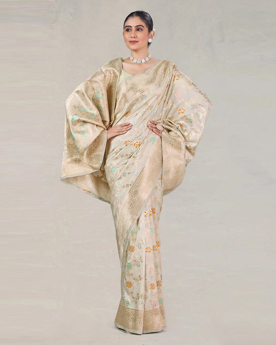Ivory Pure Katan Saree with Delicate Meenakari Florals and Gilded Weaves
