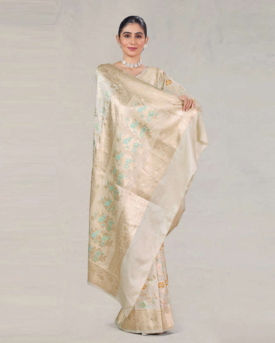 Ivory Pure Katan Saree with Delicate Meenakari Florals and Gilded Weaves
