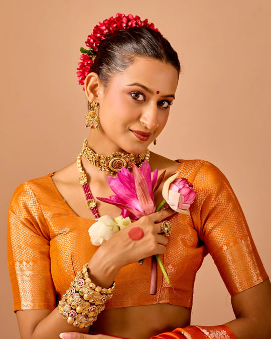 Orange Banarasi Saree with Delicate Floral Butta Weaves
