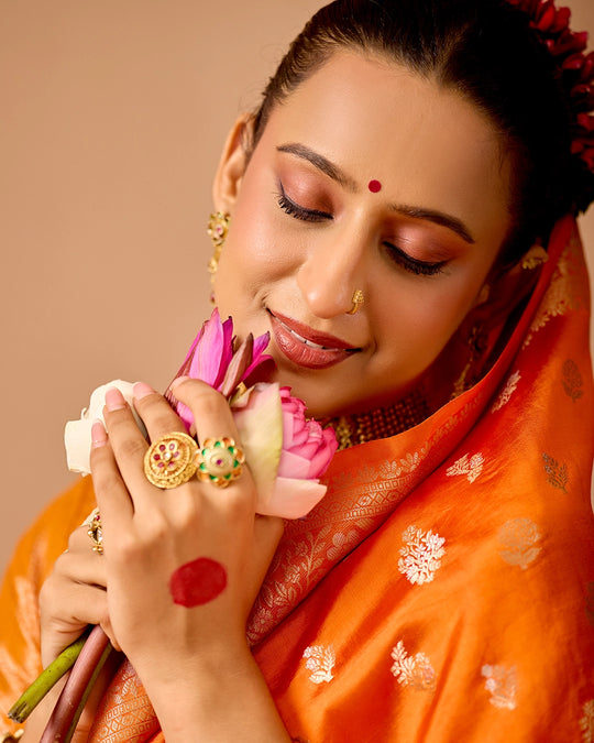 Orange Banarasi Saree with Delicate Floral Butta Weaves