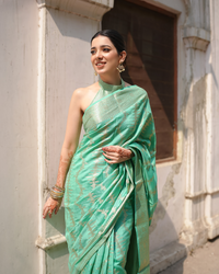 Opulent Mint Green Banarasi Silk Saree Adorned with Regal Blooming Zari and Ethereal Brocade Accents