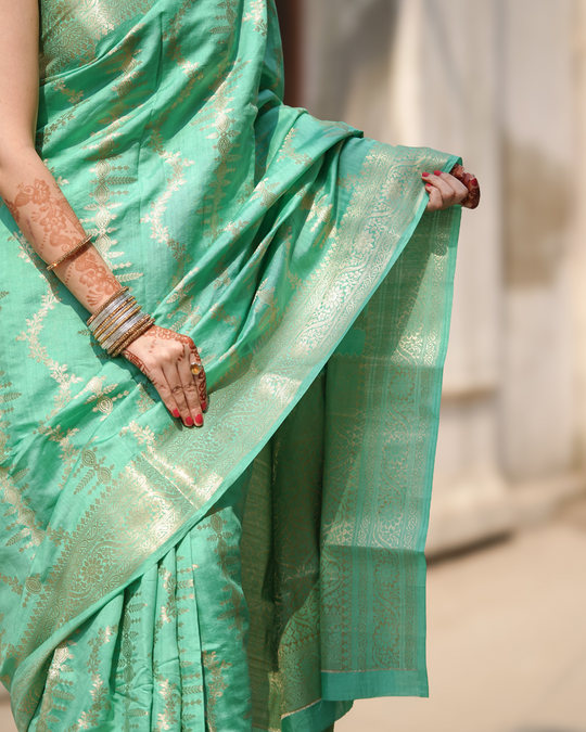 Opulent Mint Green Banarasi Silk Saree Adorned with Regal Blooming Zari and Ethereal Brocade Accents