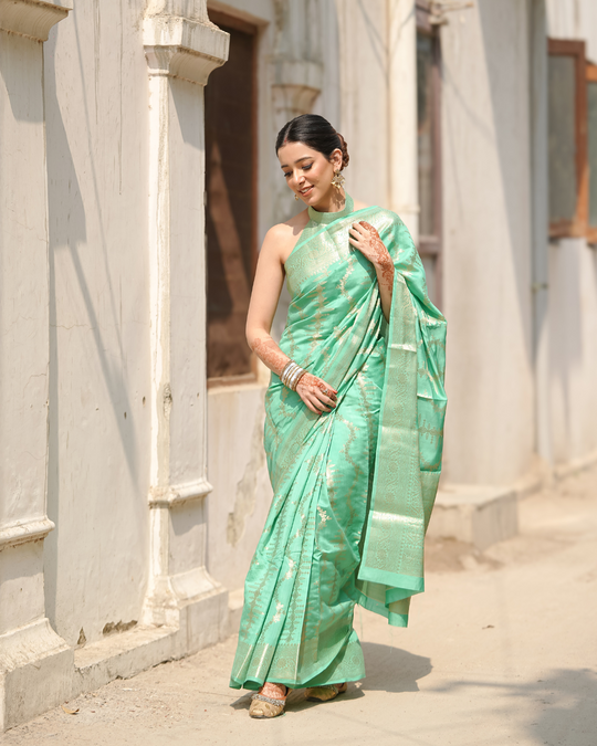 Opulent Mint Green Banarasi Silk Saree Adorned with Regal Blooming Zari and Ethereal Brocade Accents