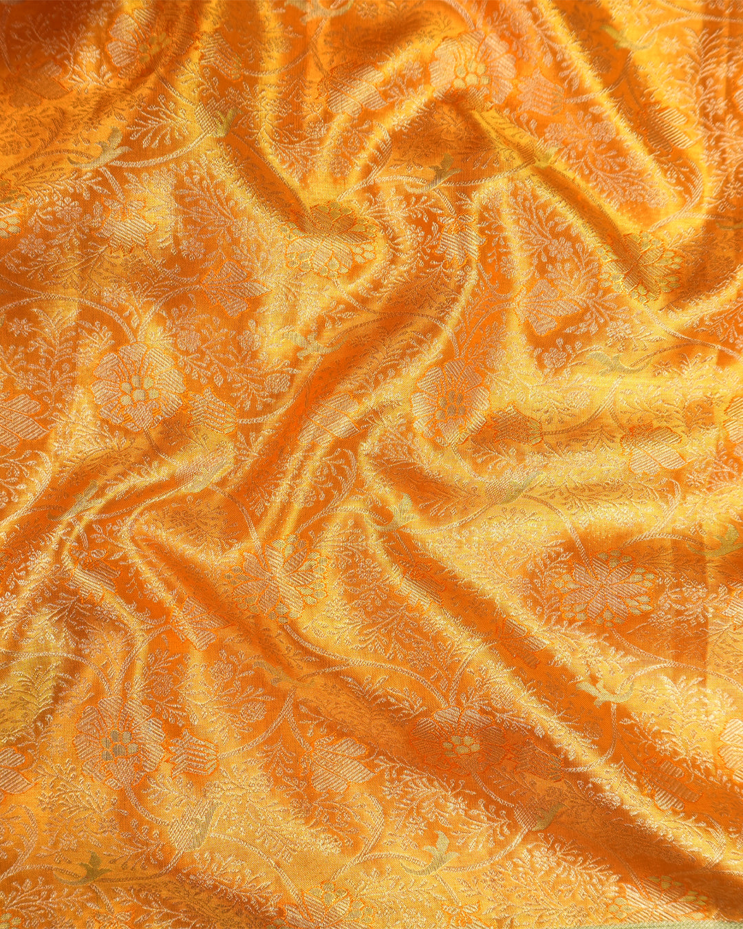 Saffron Pure Kanjivaram Saree with Floral Vine Jaal Weaves with Contrast Border