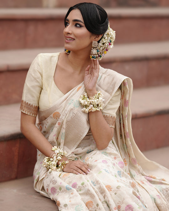 Ivory Pure Banarasi Saree with Pastel Florals Weaves and Subtle Zari Accents