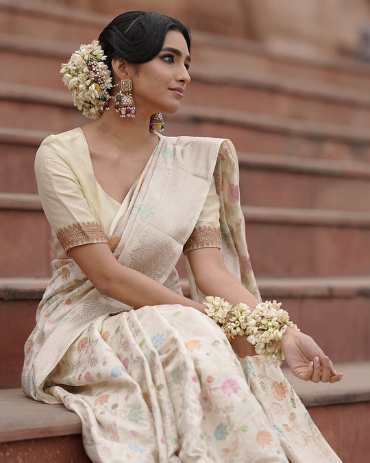 Ivory Pure Banarasi Saree with Pastel Florals Weaves and Subtle Zari Accents