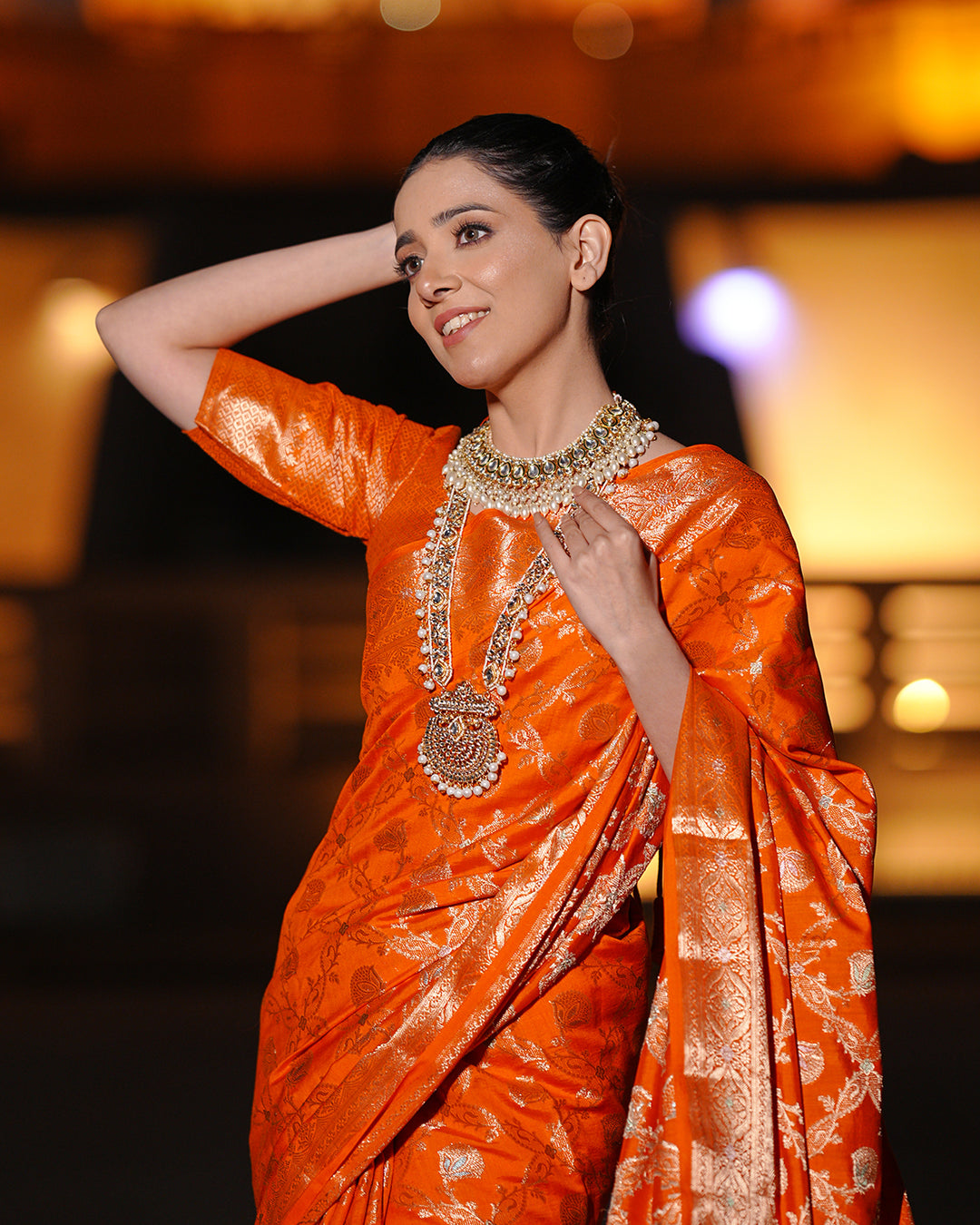 Vibrant Orange Pure Banarasi Silk Saree with Intricate Rich Golden Zari Work Embellishments